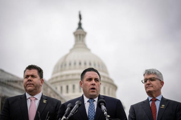 Flanked by Rep. Brandon Williams (R-NY) and Rep. Nick Lalota (R-NY), Rep. Anthony D'Esposito (R-NY) speaks during a news co<em></em>nference outside the U.S. Capitol on March 7, 2023 in Washington, DC.