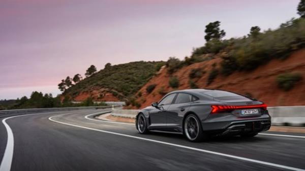 Audi RS e-tron GT performance: rear three quarter driving, grey paint