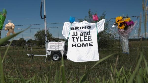 Items are seen hanging on the fence in memory of Tylee Ryan, 17, and Joshua 