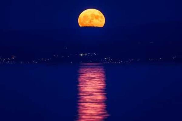 July's full moon, nicknamed the buck moon, will peak early Sunday morning. The buck moon is seen peaking over the horizon in Split, Croatia, on July 3, 2023.