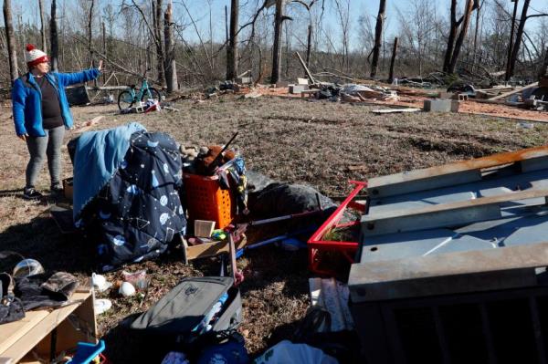 A woman points to wher<em></em>e her mobile home was located before the tornado ripped through Central Alabama earlier this week destroying her home on Jan. 14, 2023 in Marbury, Ala.