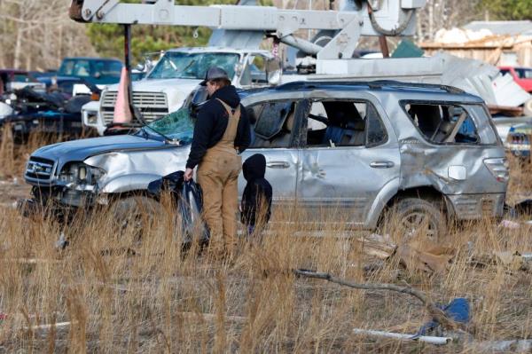 Friends and family help sift through debris looking for perso<em></em>nal items in Central Alabama after the devastating tornado.