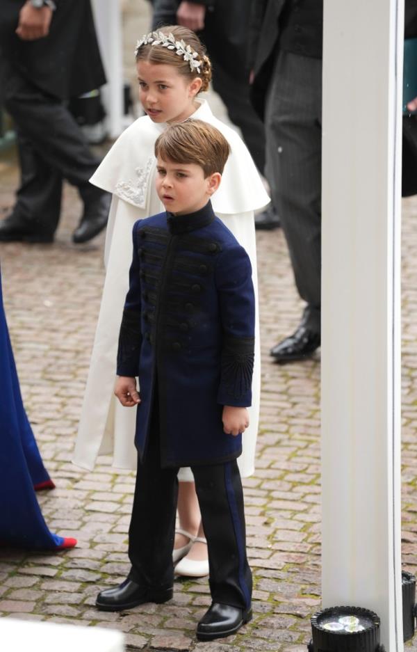 Louis looked dapper in a navy coat as he entered Westminster Abbey. 