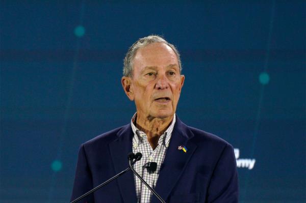 Picture of Bloomberg speaking at a press conference.