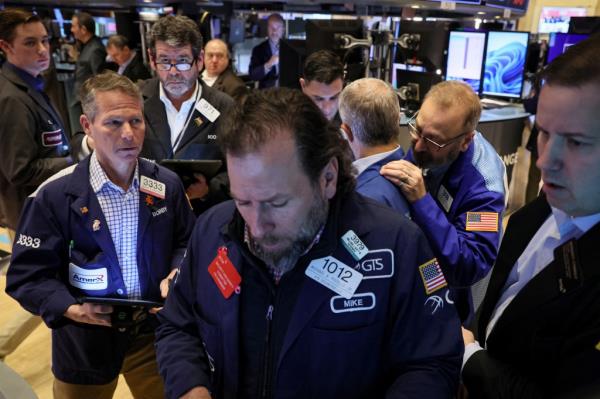 Traders work on the floor of the New York Stock Exchange.