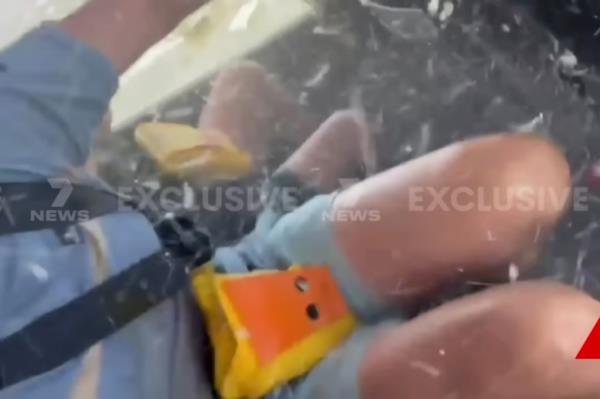 Broken glass flies through the cabin