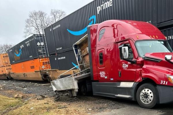 The freight train rammed into the commercial truck Thursday morning.