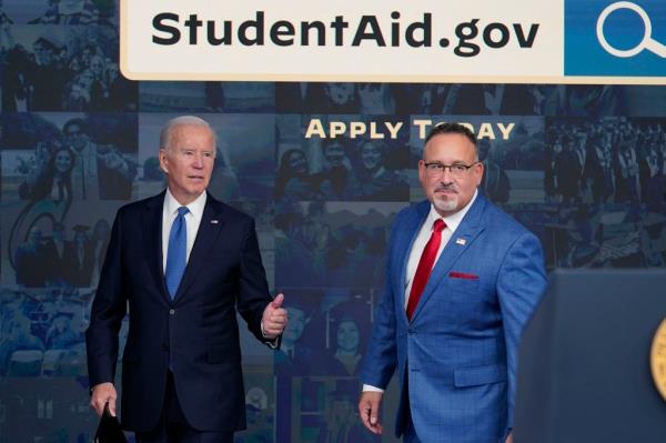 President Biden and Education Secretary Miguel Cardona at the White House on Oct. 17.