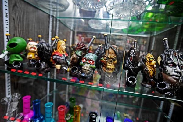 A collection of pipes and paraphernalia made to look like skulls.