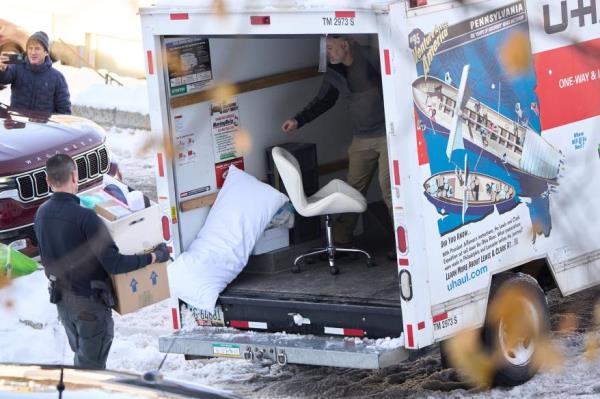 The slain students' furniture being packed o<em></em>nto a truck.