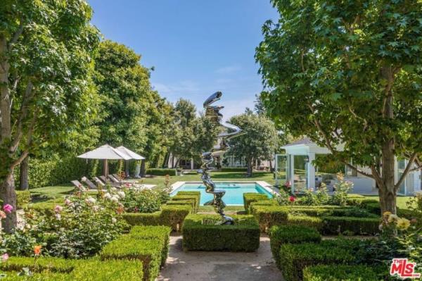 The pool and manicured gardens.