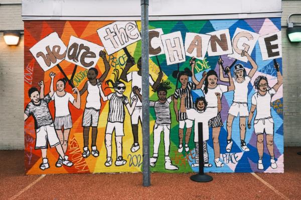 A mural at Success Academy Harlem 2 reads 