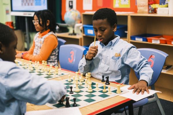 Students play chess at Success Academy Harlem 2 in Manhattan on Feb. 17.