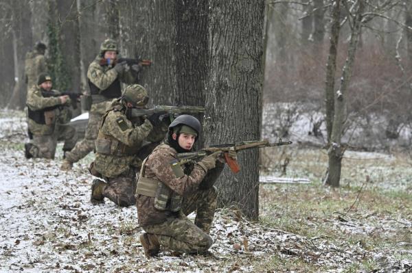 Ukrainian soldiers take firing positions while participating in a military training exercise in the Kherson region Wednesday. 