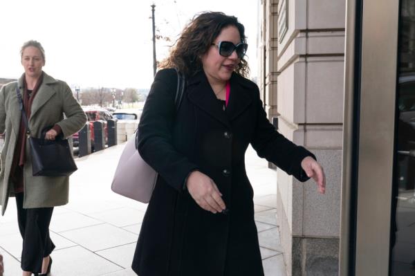 Sicknick's partner Sandra Garza enters the courthouse. 
