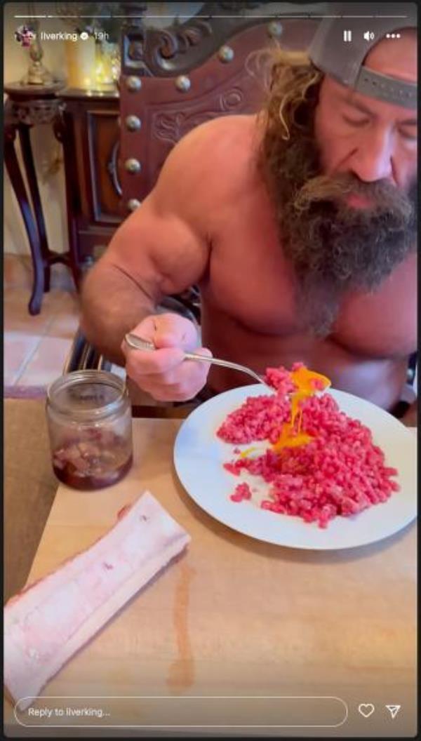 Liver King eating raw meat, in image from social media story Friday.