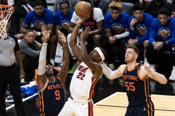 Jimmy Butler, who scored a game-high 28 points, goes up for a layup over RJ Barrett during the Knicks' 105-86 Game 3 loss to the Heat.