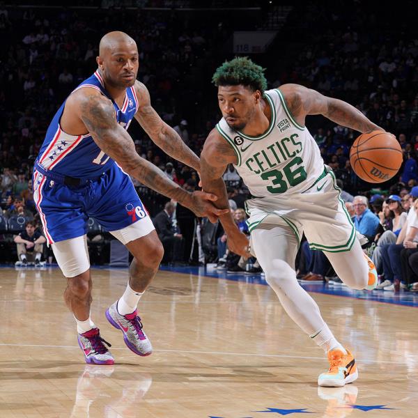Marcus Smart #36 of the Boston Celtics dribbles the ball against Sixers' PJ Tucker  on April 4, 2023 at the Wells Fargo Center in Philadelphia, Pennsylvania. 