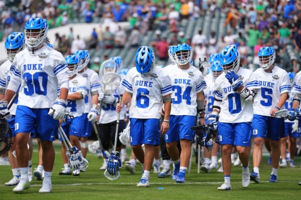 Duke players walk off the field after losing to Notre Dame in the natio<em></em>nal champio<em></em>nship on May 29. 