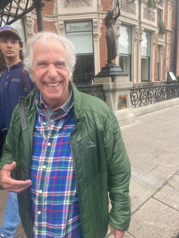 Winkler smiles at a camera.