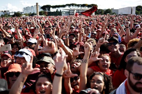 Supporters of Brazil's new President Luiz Inacio Lula da Silva gather outside the Planalto Palace in Brasilia, Brazil on Jan. 1, 2023.