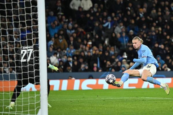 Manchester City's Norwegian striker Erling Haaland shoots to score their third goal during the UEFA Champions League quarter final, first leg football match between Manchester City and Bayern Munich at the Etihad Stadium in Manchester, north-west England, on April 11. - Pic: AFP