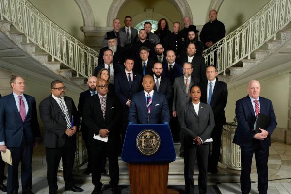 New York City Mayor Eric Adams (lower center) holds a press co<em></em>nference at City Hall in lower Manhattan, New York on Monday, Nov. 21, 2022, to discuss the coordinated effort that stopped the attack on the Jewish community.