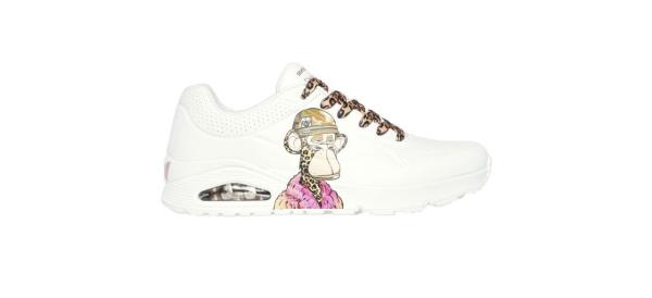 white leather sneakers with an image of Dr. Bombay (a cartoon mo<em></em>nkey with cheetah skin wearing a beanie and a fluffy pink coat) on the side and beige cheetah-print laces
