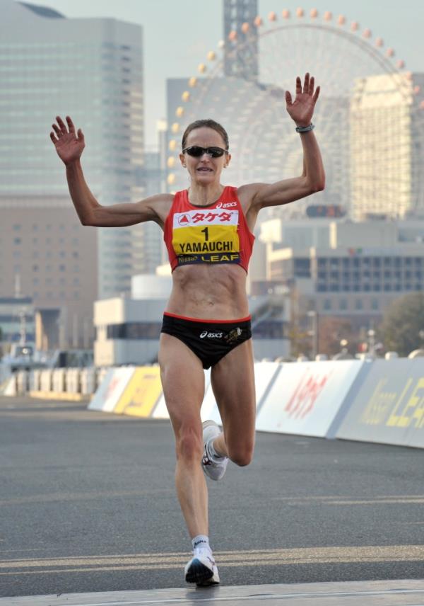 Mara Yamauchi of Britain crosses the finish line in third place at the 2011 Yokohama women's marathon