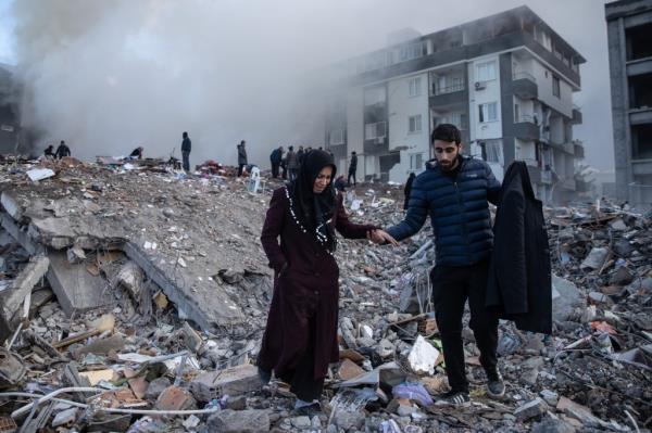 Earthquake survivors wait for news of their loved ones, believed to be trapped under collapsed building on February 07, 2023 in Iskenderun, Turkey