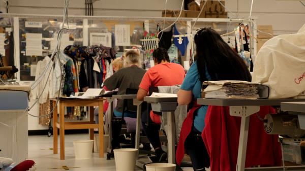 Priso<em></em>ners work in a fashion production workshop at HMP Downview.