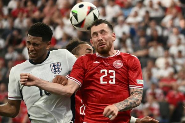 Denmark's midfielder #23 Pierre-Emile Hojbjerg and England's midfielder #10 Jude Bellingham fight for the ball during the UEFA Euro 2024 Group C football match between Denmark and England at the Frankfurt Arena in Frankfurt am Main on June 20, 2024. (Photo by AFP)