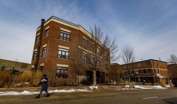 A mail carrier walks past the Southwest Side home of Ald. Edward Burke on Nov. 29, 2018. 