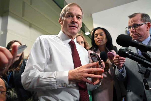 Jim Jordan (C), R-OH, speaks to the press as he leaves after a Republican party caucus meeting at the US Capitol in Washington, DC, on October 16, 2023.