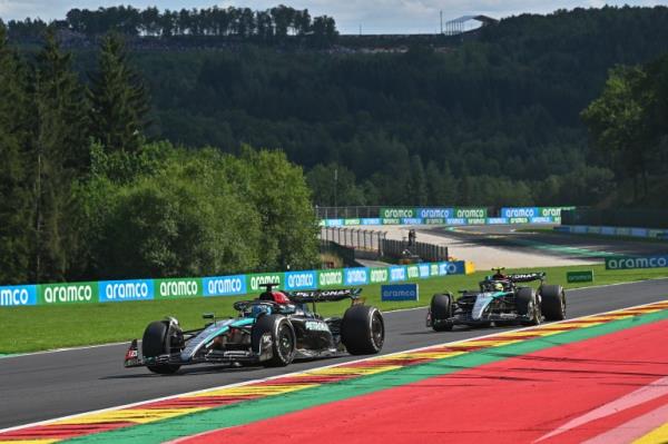 Race drivers on track.