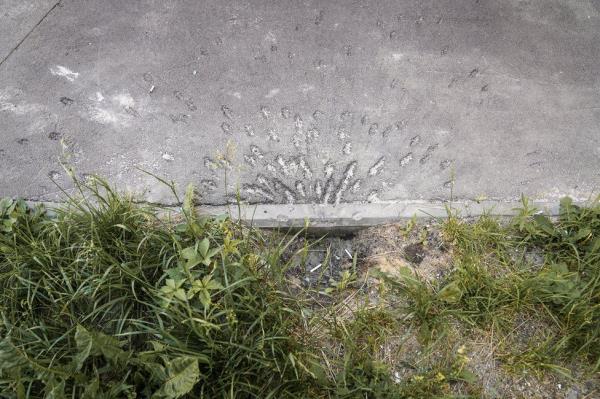 An impact site next to wher<em></em>e Ivan Litvynyenko's wife was hit by shrapnel. (Joel Gunter/BBC)