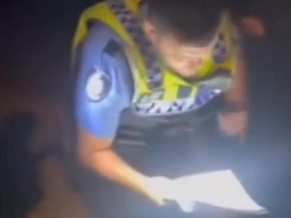 The TikTok video shows the officer reading the terms of the order. Tiktok