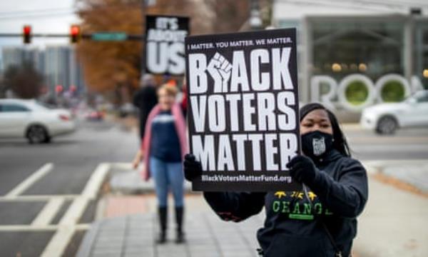 Protesters associated with Black Voters Matter demo<em></em>nstrate outside Senator Jon Ossoff’s office as part of a natio<em></em>nal campaign urging President Biden and the US Senate to pass voting rights legislation in Atlanta on 9 December 2021.