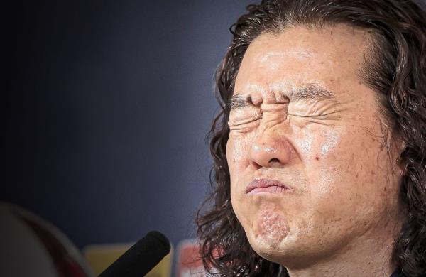 Painful: Head coach Kim Pan-gon reacts during the press conference. — Bernama