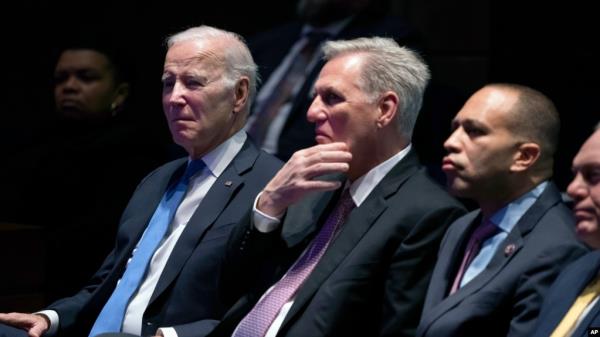 FILE - From left, U.S. President Joe Biden, then-Speaker of the House of Representatives Kevin McCarthy, House Minority Leader Hakeem Jeffries and House Majority Leader Steve Scalise listen during the Natio<em></em>nal Prayer Breakfast, at the Capitol in Washington, Feb. 2, 2023.