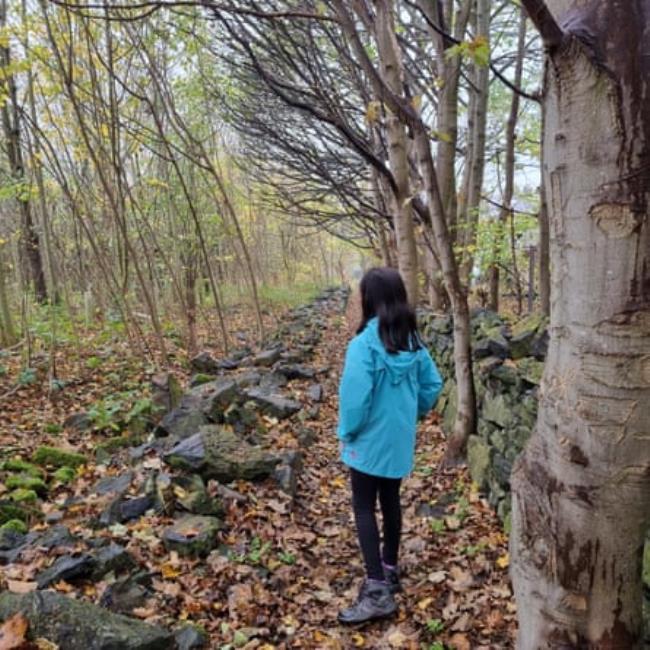 Jenna walking in the woods
